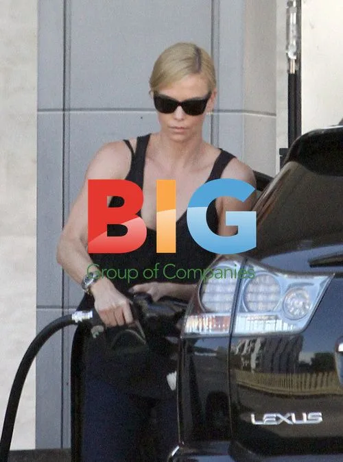 Charlize Theron Pumping Gas in LA