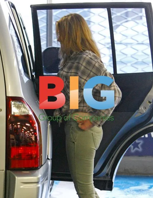 Charlotte fills car, gets car washed