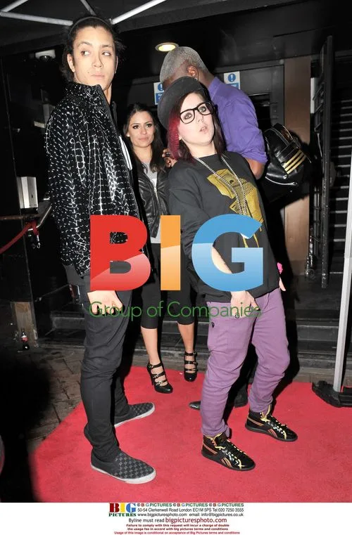 Lady Sovereign and date at Malice in Wonderland afterparty