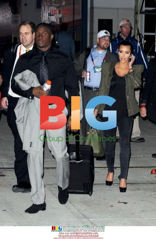 Kim Kardashian and Reggie Bush Leave Super Bowl