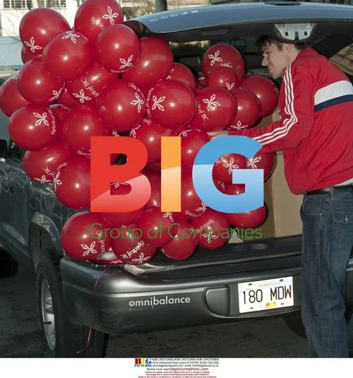 Decorative Balloons Stuffed Into Hatchback