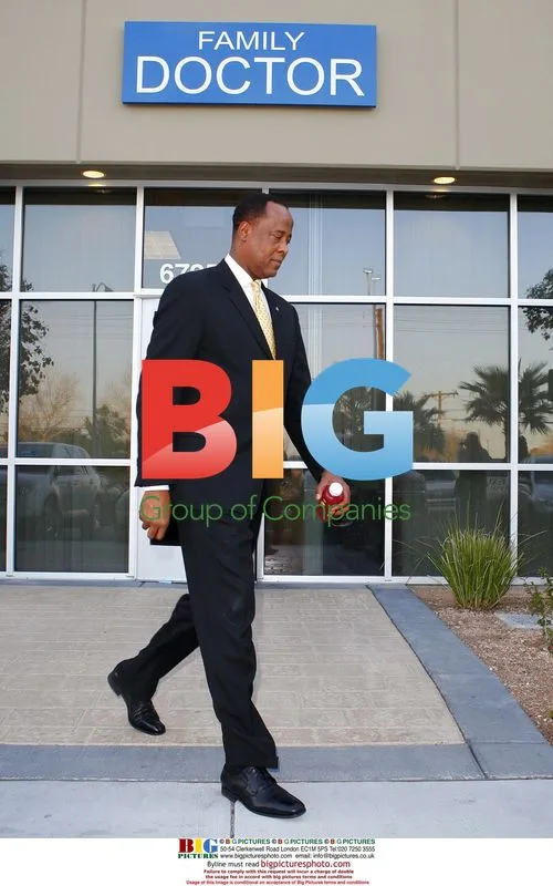 Dr. Conrad Murray Exits New Office