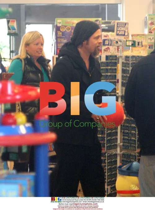 Brad Pitt goofs around at toy store in Malibu