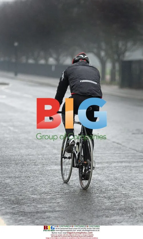 David Williams rides bike in rain
