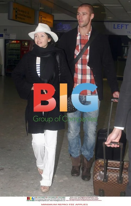 Dannii Minogue and Kris Smith Arrive at Heathrow