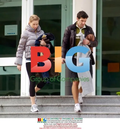 Luis Figo and wife leaving gym in Spain