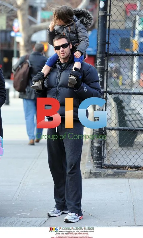 Hugh Jackman carries daughter Ava