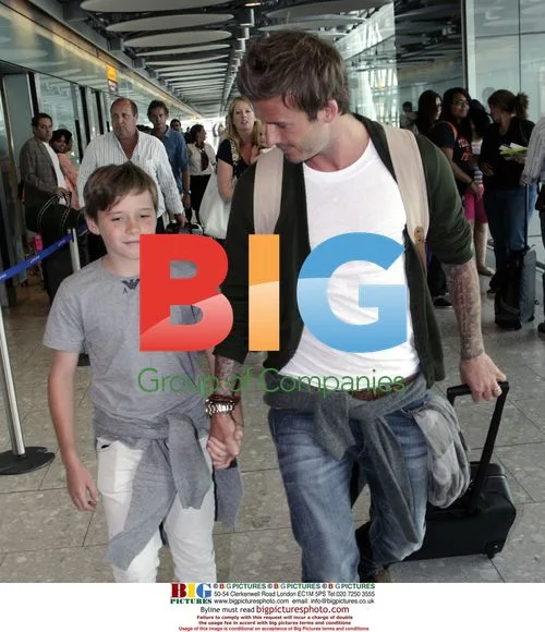 David Beckham and son at airport