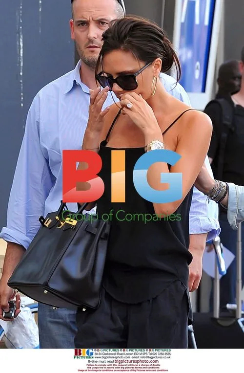 Victoria Beckham Hides Cold Sore at Airport