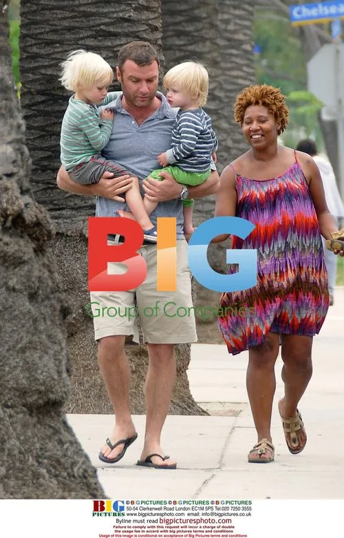 Liev Schreiber and sons playing at playground