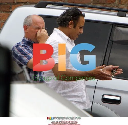 Corrie actor Jimmi Harkishin giving directions