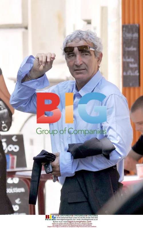 Raymond Domenech chats with fan after World Cup exit