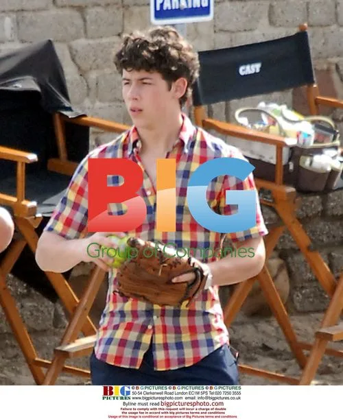 Nick Jonas Plays Catch on Set