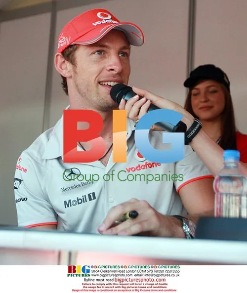 F1 Drivers Button and Hamilton Signing Autographs