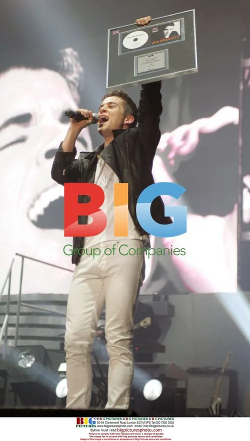 Joe McElderry receives Platinum Disc at X Factor Tour