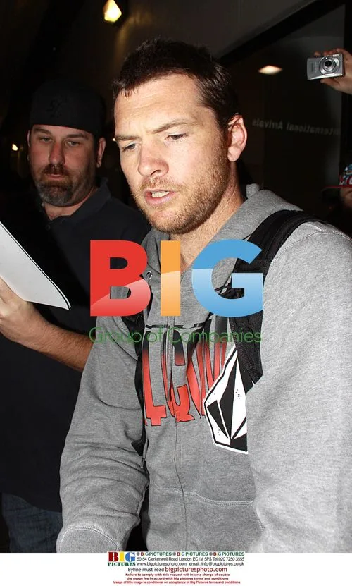 Sam Worthington Arrives at LAX