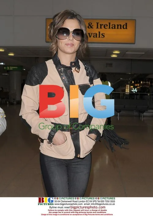 Cheryl Cole Arrives at Heathrow
