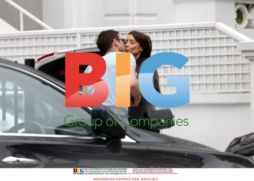 Chelsea footballer and TV presenter kiss