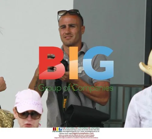 Fabio Cannavaro relaxes poolside in Miami
