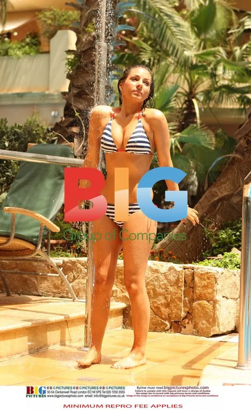 Roxanne Pallette Relaxes Poolside