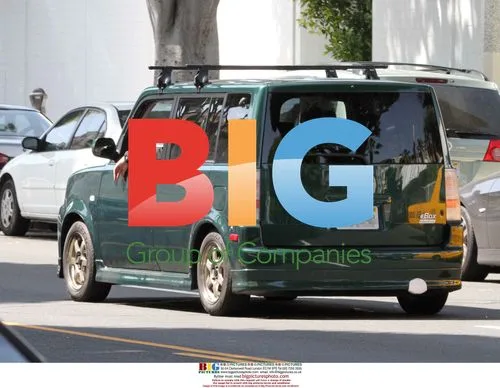 Tom Hanks shops with kids, drives electric car