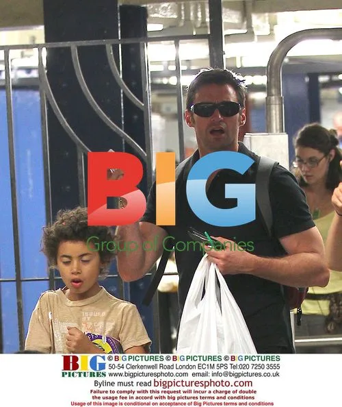 Hugh Jackman Picks Up Kids