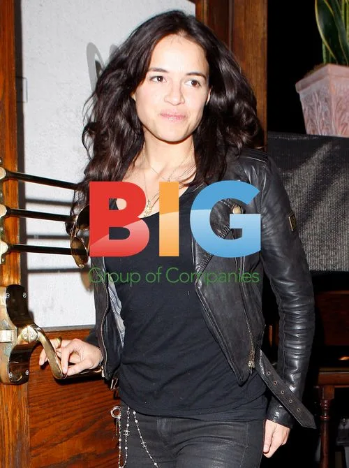 Michelle Rodriguez has a nose itch