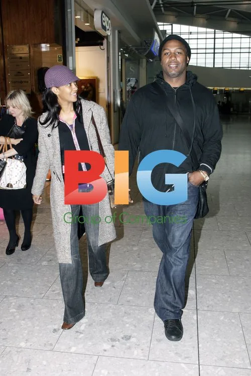 Lennox Lewis and partner at Heathrow