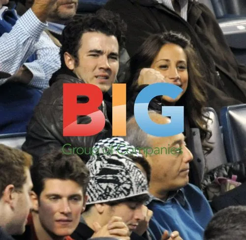 Kevin Jonas and wife at ALCS game