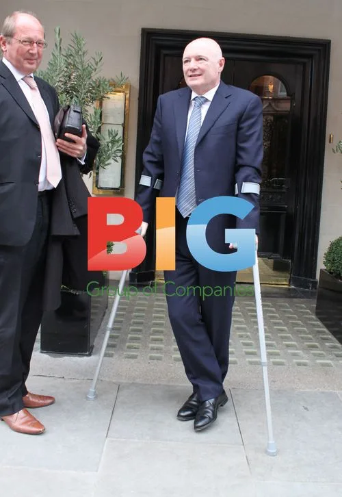 Peter Kenyon on Crutches