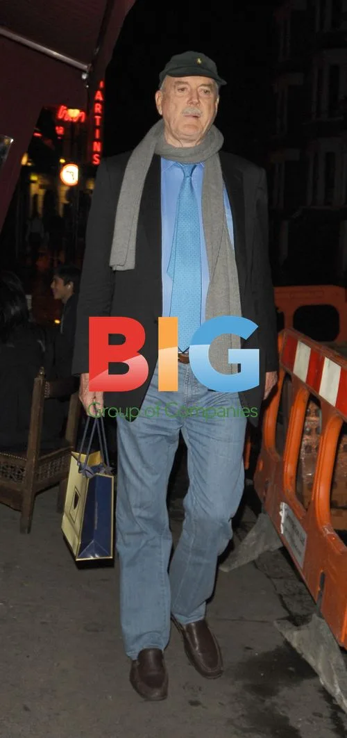 Sir John Cleese Leaves The Ivy, London