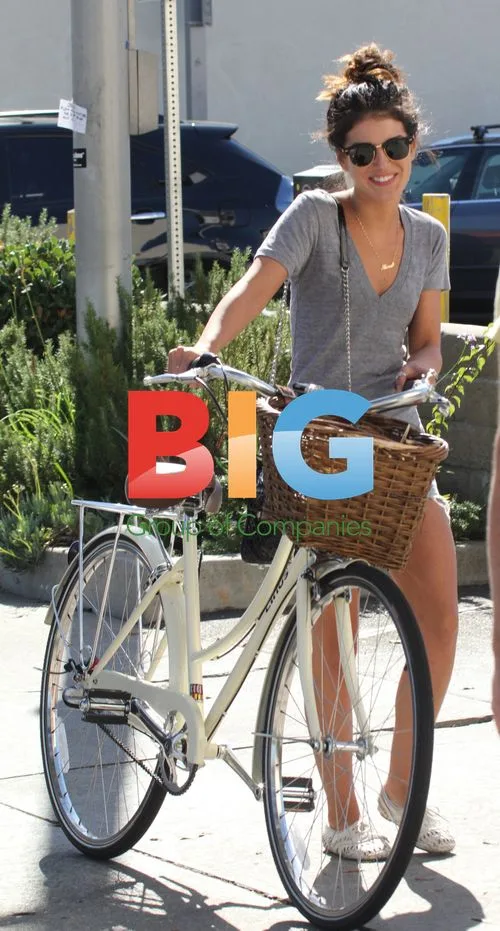 Actress Shenae Grimes Locks Up Bike