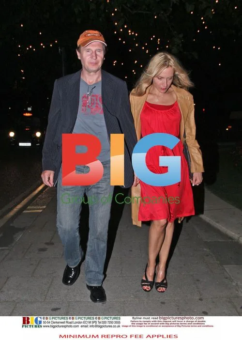 Liam Neeson with mystery blonde woman