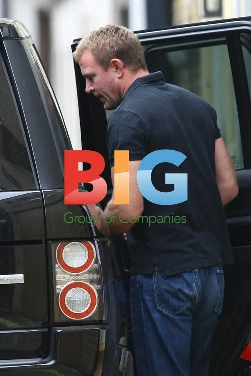 Guy Ritchie Leaves with Associate