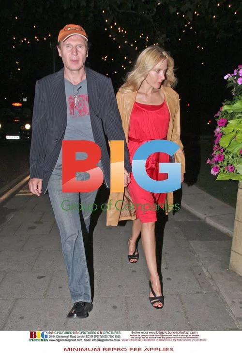 Liam Neeson with blonde woman
