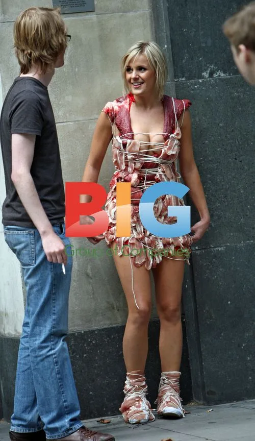 Model poses in Meat Dress replica