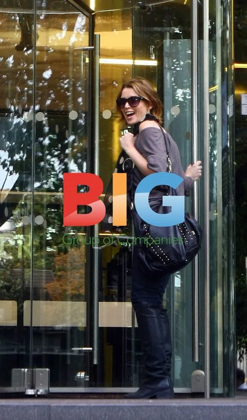 Dannii, Kris and baby Ethan leave hotel