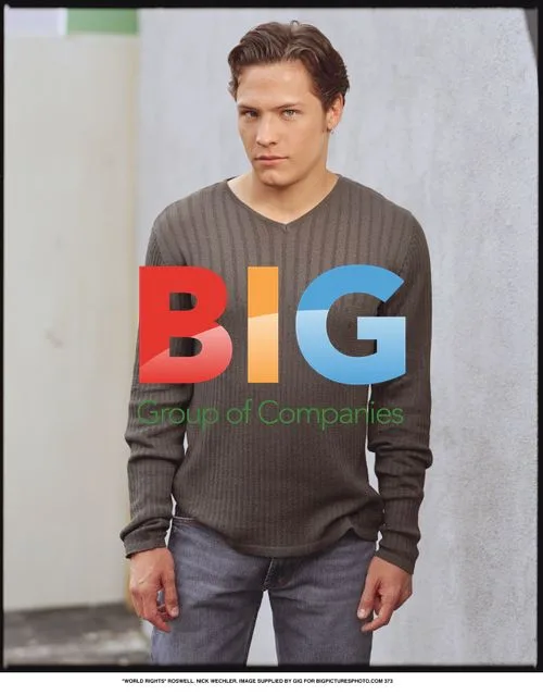 Nick Wechler in Grey Top and Blue Jeans