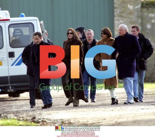 Newlyweds Sarkozy and Bruni Take Stroll