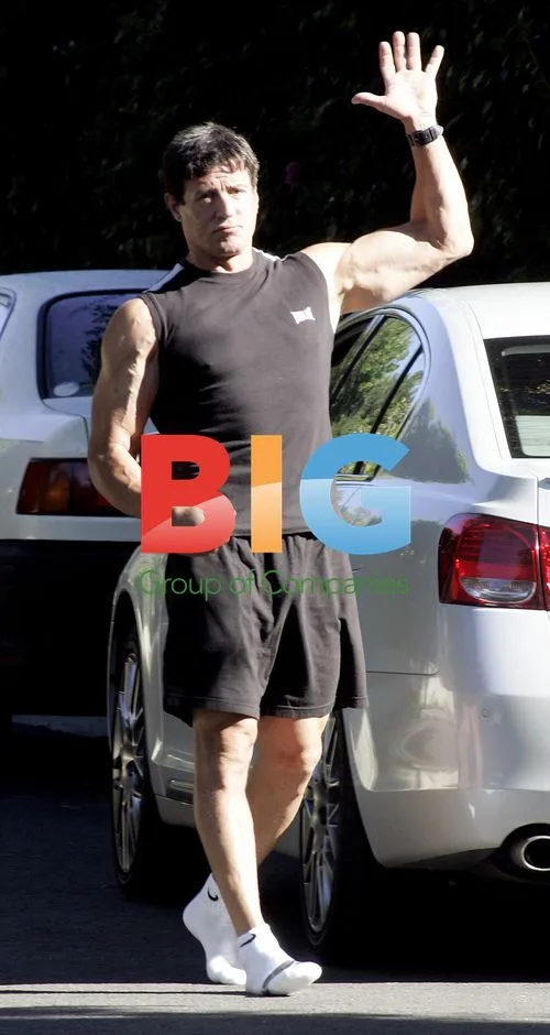 Sylvester Stallone walks around in socks