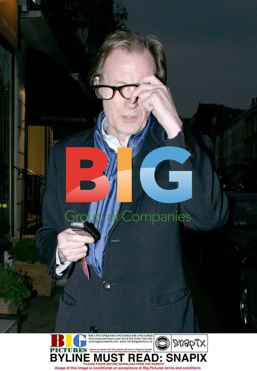 Bill Nighy spotted using mobile phone in London