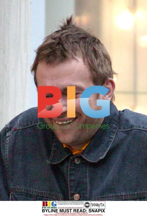 Damon Albarn Pushes Bike in West London