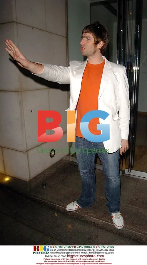 Liam Gallagher poses outside Nobu restaurant