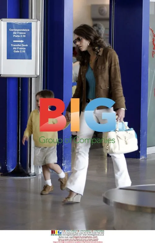Liz Hurley with family at Paris airport