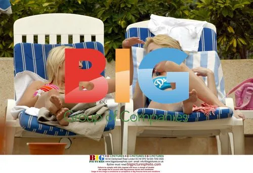 Glamour models Michelle Marsh and Jo Hicks poolside
