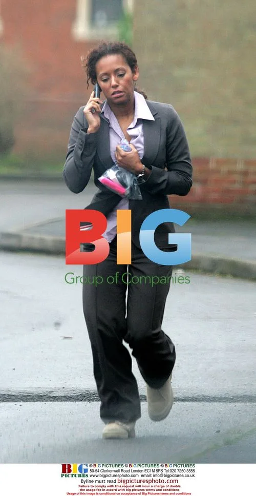 Mel B Chats on Mobile Before Meeting Friend