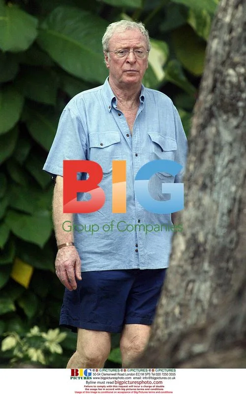 Michael Caine Strolls on Barbados Beach
