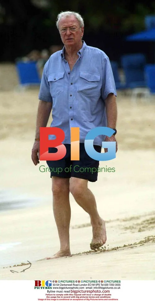Michael Caine walks on Caribbean beach
