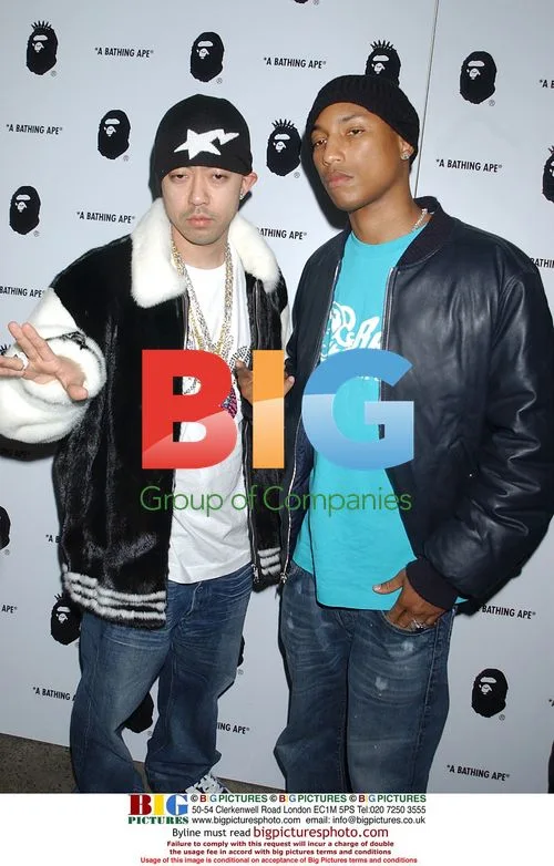 Nigos and Pharrell Williams at 'A Bathing Ape' store opening