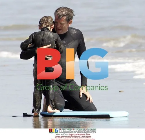 Pierce Brosnan takes son Paris for surf lesson
